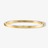 gold waterproof bangle bracelet shown on a grey background 
