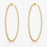 large gold hoop earrings with small pave cubic zirconia stones shown on grey background