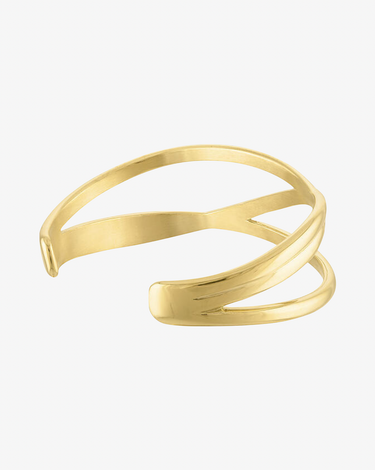 side view of waterproof gold cuff bracelet with overlapping lines shown on grey background