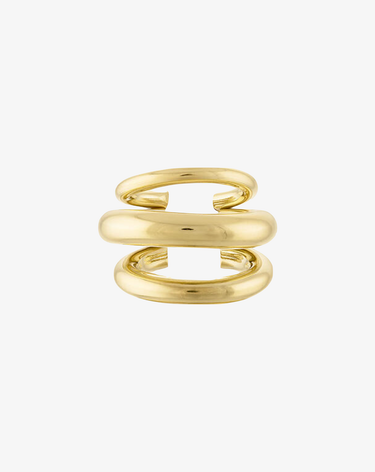 front view of gold ear cuff with multi lines, 3 to be exact shown on a grey background
