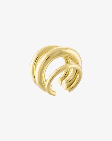 side view of gold ear cuff with multi lines, 3 to be exact shown on a grey background